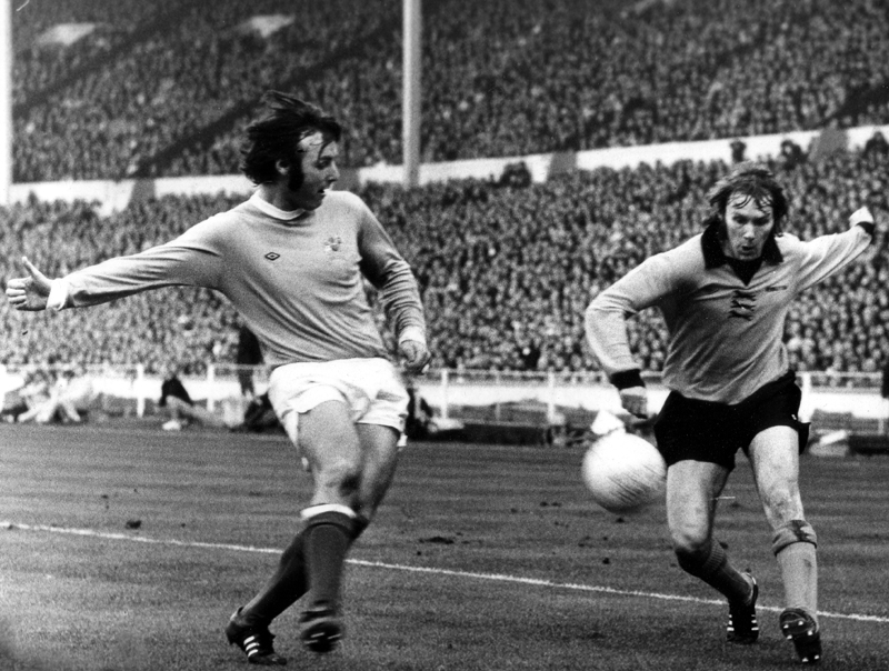 Ooh, mind that thigh! Waggy attempts a cross despite the close attention of Glyn Pardoe. 